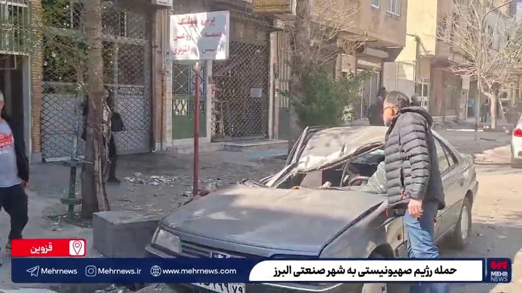 Damage to storefronts and a civilian vehicle in the area